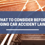 Title "What consider before changing car accident lawyers" over train tracks crossing.