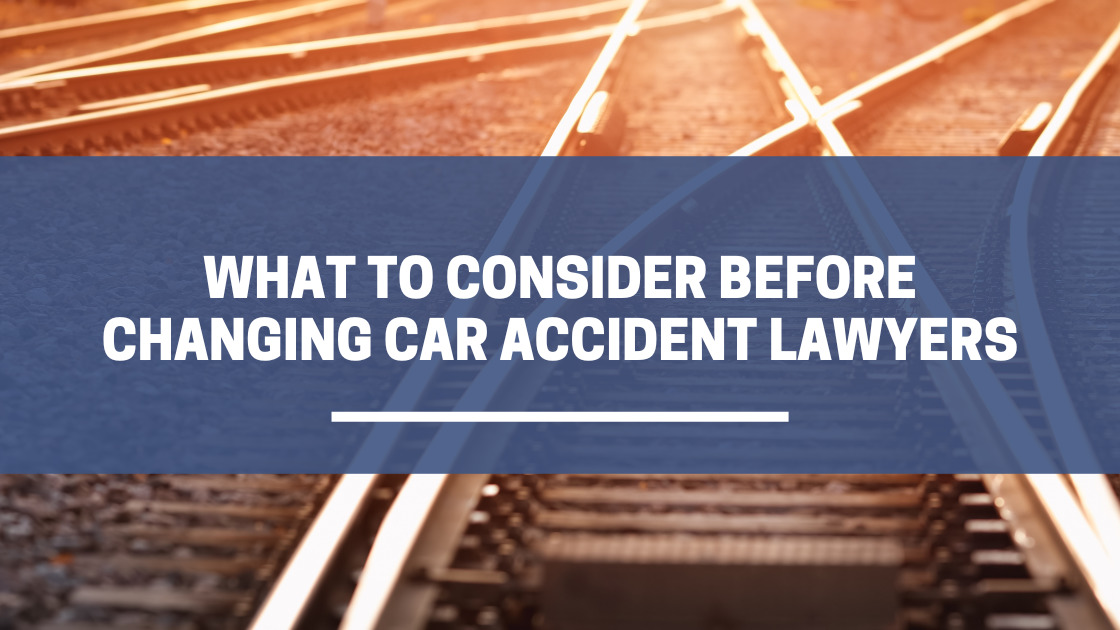 Title "What consider before changing car accident lawyers" over train tracks crossing.